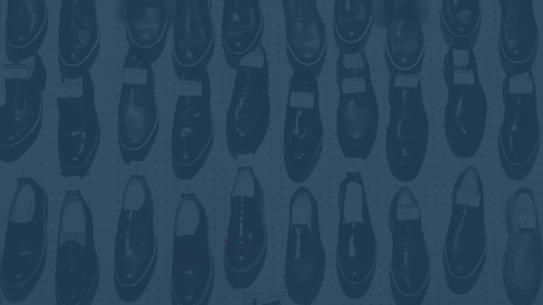 Wall of vintage shoes with a blue overlay